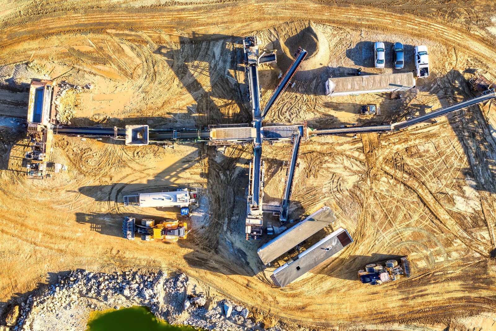 Aerial view of heavy mining machinery and conveyor system