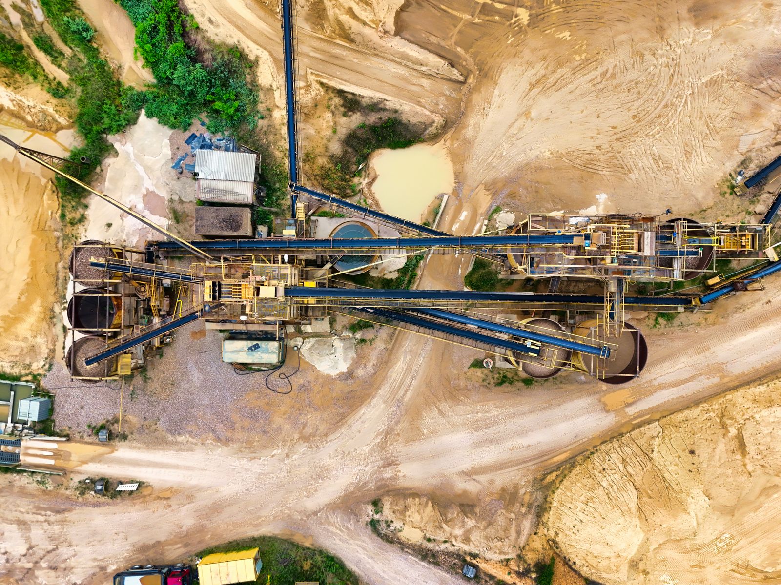 Aerial mining site with conveyors and earthwork